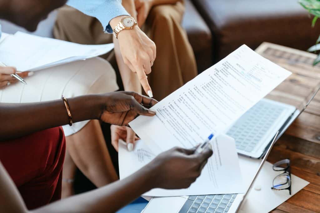 Business women reviewing documents in office