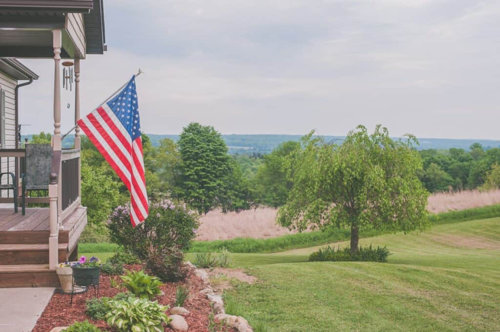 USA Flag hanging from House Patio